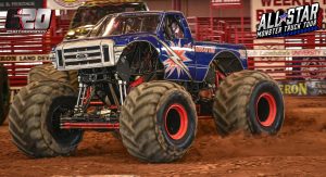 Illuminator Monster Truck drifting around a turn for the racing victory