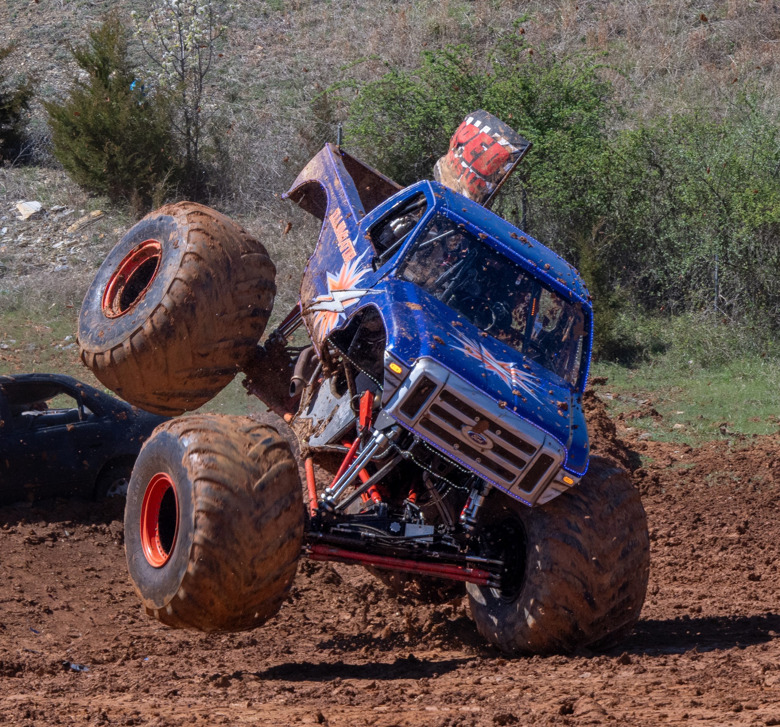 The Illuminator Monster Truck taking an awkward landing during a very wild freestyle competition performance 