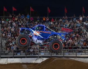 Illuminator monster truck catching some hang time in front of the sold out audience in Gaithersburg, MD at the Montgomery County Fair
