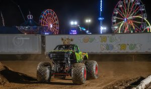 Toxic Monster Truck during the freestyle competition with the Montgomery County Fair in the background
